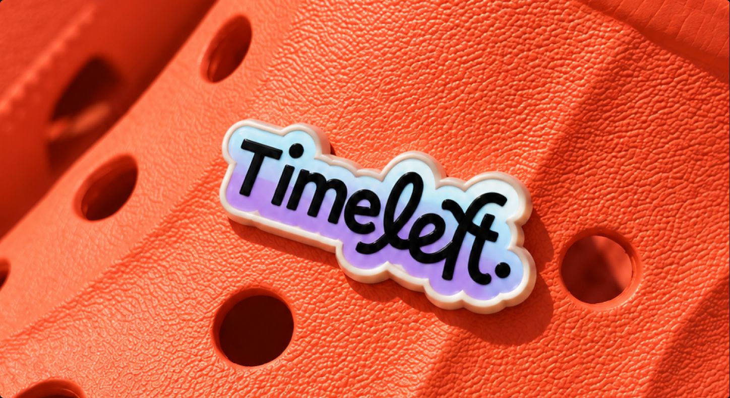 Timeleft logo pin clipped on an orange clog