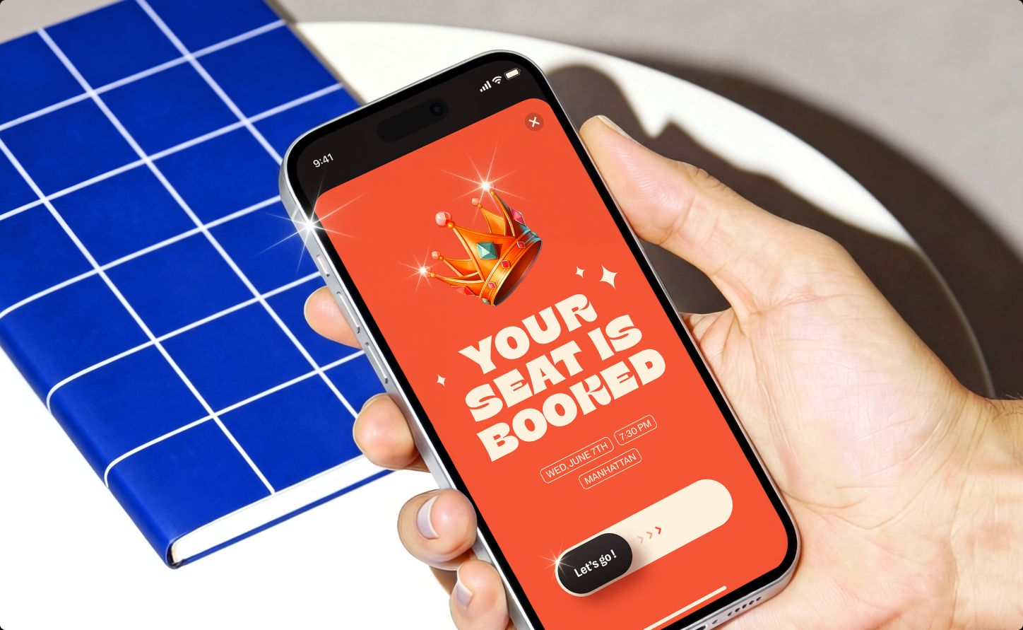 Phone showing the "Your seat is booked" confirmation screen with a crown illustration