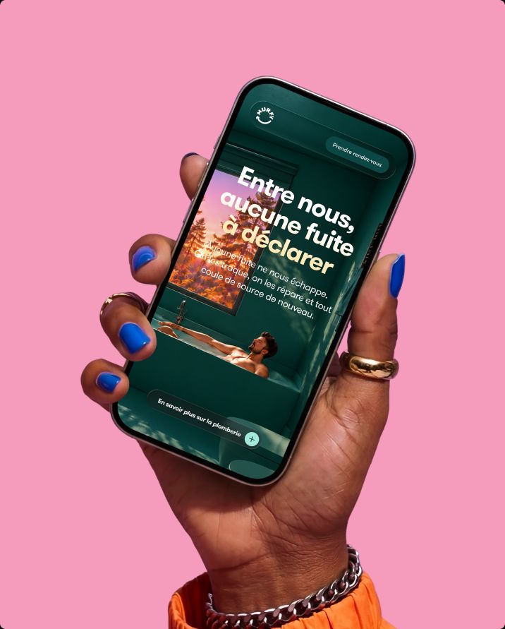 Hand holding a phone with the Murfy plumbing page