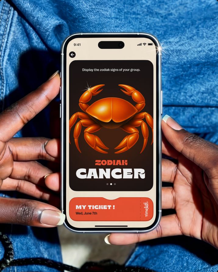 Hands holding a phone displaying the zodiac sign of the group